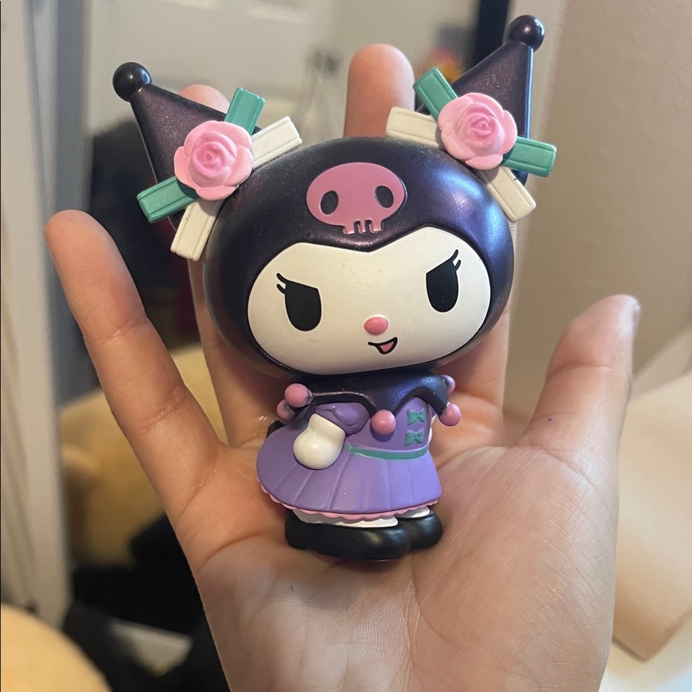 Charming Purple and Black Figurine with Pink Accents